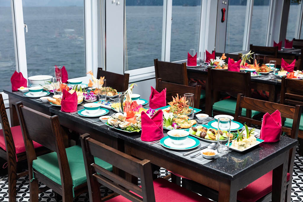Savor gourmet dining while anchored among Halong Bay’s islands